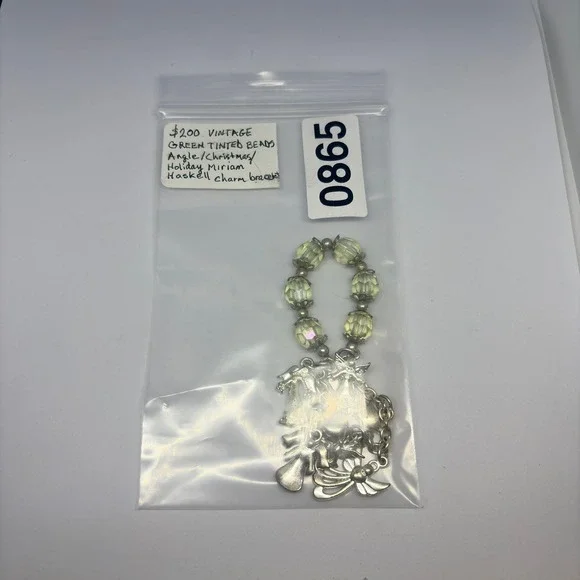 Vintage Miriam Haskell holiday angel-theme charm bracelet green tinted beads